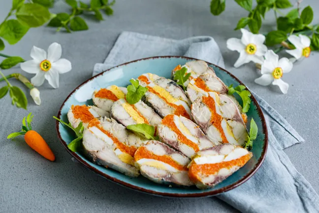 Scomber roulade with egg and carrot
