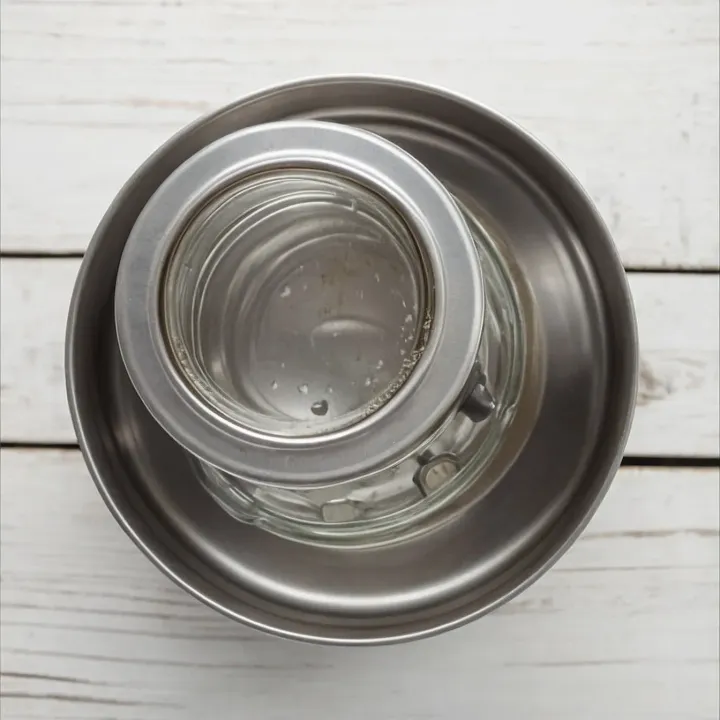 Prepare 0.5 l jars by thoroughly washing them with a degreasing agent. Sterilize the jars using any method convenient for you to ensure the safety of the preservation. After sterilization, turn the jars upside down on a clean towel and let them dry completely.
