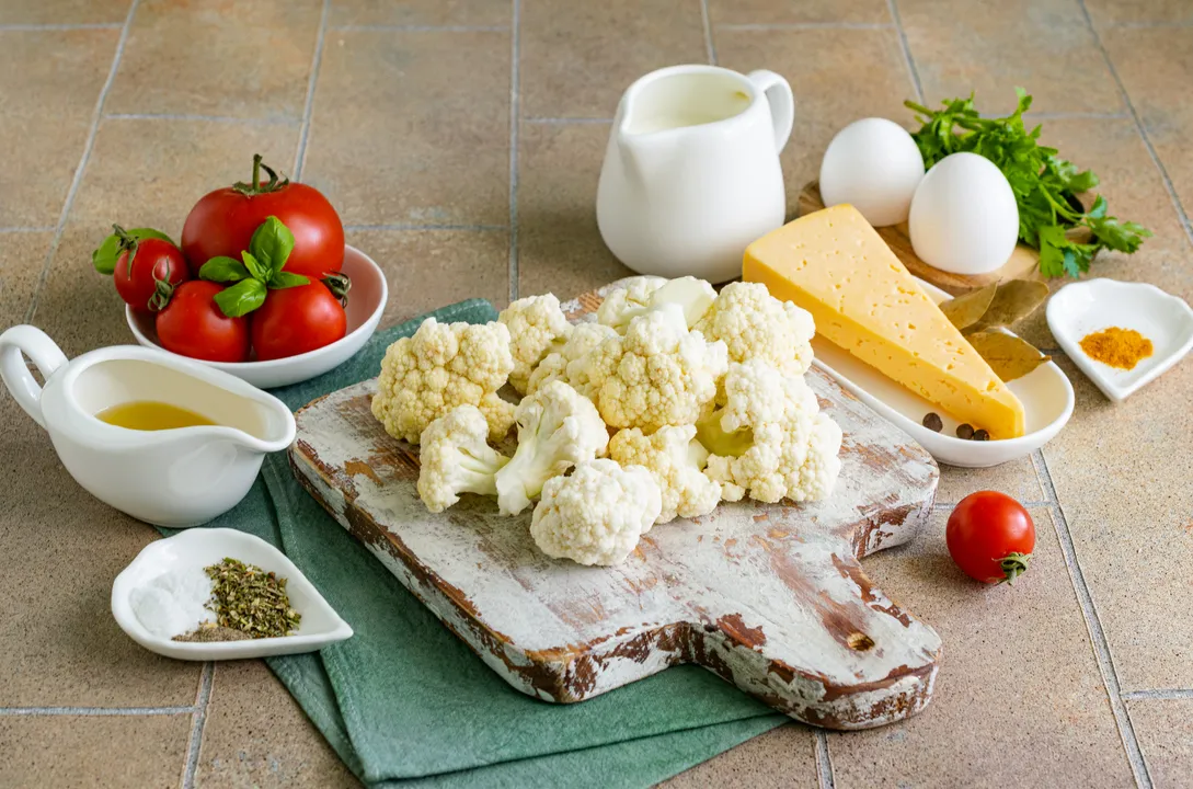 <p>Separate the cauliflower into small florets.</p>