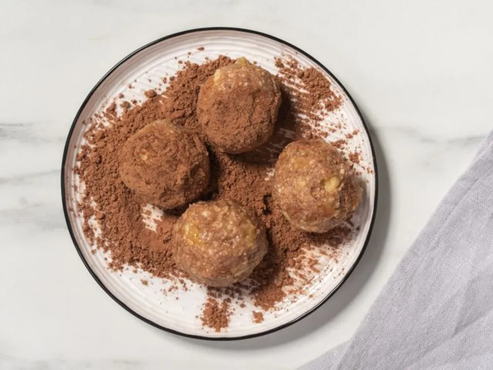 Roll each pastry in the remaining cocoa powder. Then transfer them to a plate and refrigerate for 30 minutes to set.
