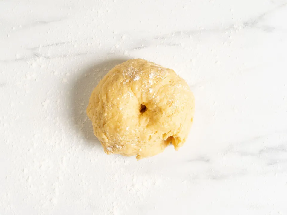 The amount of flour may vary. Focus on the consistency of the dough: it should be quite firm, yet elastic, similar to dumpling dough.