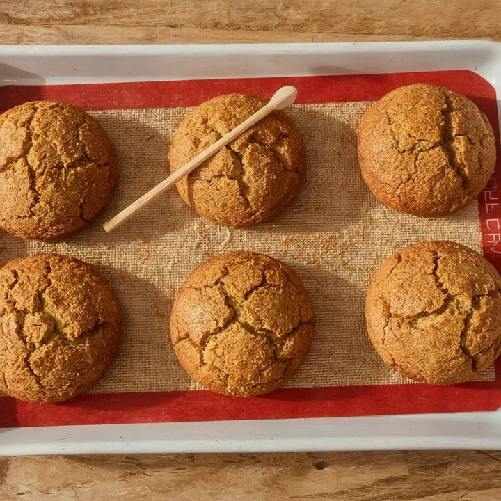 Bake the sponge cupcakes in a preheated oven for 20–25 minutes, until golden brown. Check for doneness by gently inserting a wooden skewer into one of the cupcakes. If the skewer comes out clean, without any sticky batter, the cupcakes are ready.