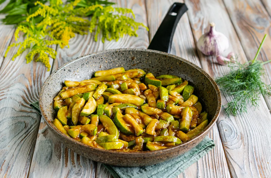Continue to simmer the zucchini over low heat for 1-2 minutes until the sauce thickens.