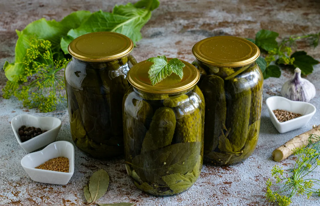Turn the jars of preserves upside down. Wrap them thoroughly with a blanket or throw, and leave them to cool completely for several days.