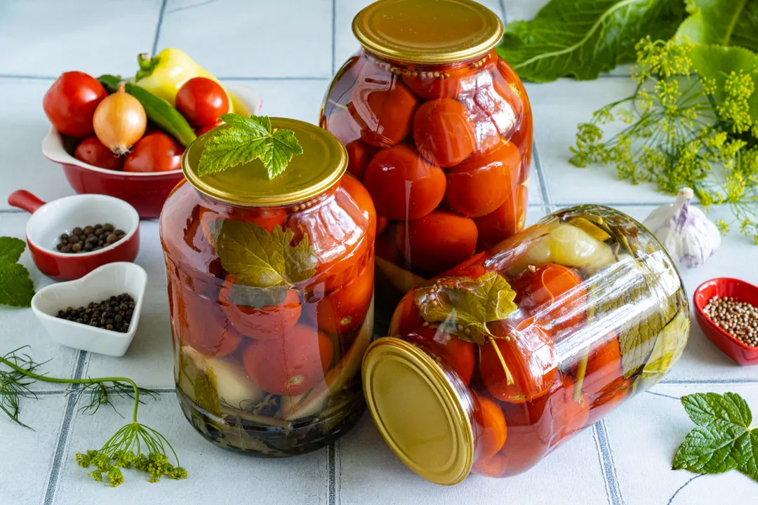 Store pickled tomatoes for winter in a dark, cool place.