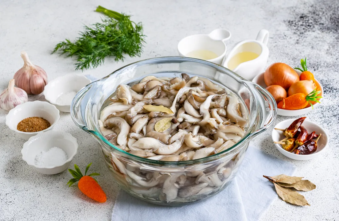 Place the oyster mushrooms in a pot of boiling salted water. Add bay leaf and allspice for flavor.