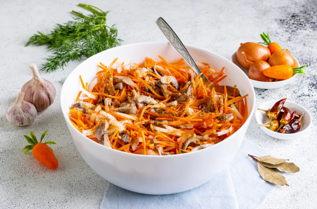 Pour boiling marinade over the oyster mushrooms and vegetables. Stir the appetizer, cover it with a lid or plastic wrap, and refrigerate for at least 4 hours, preferably overnight.